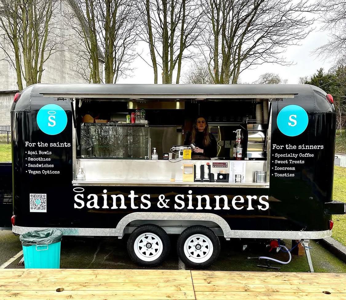 The Saints & Sinners trailer, hatch open, on the green at Mount Merrion